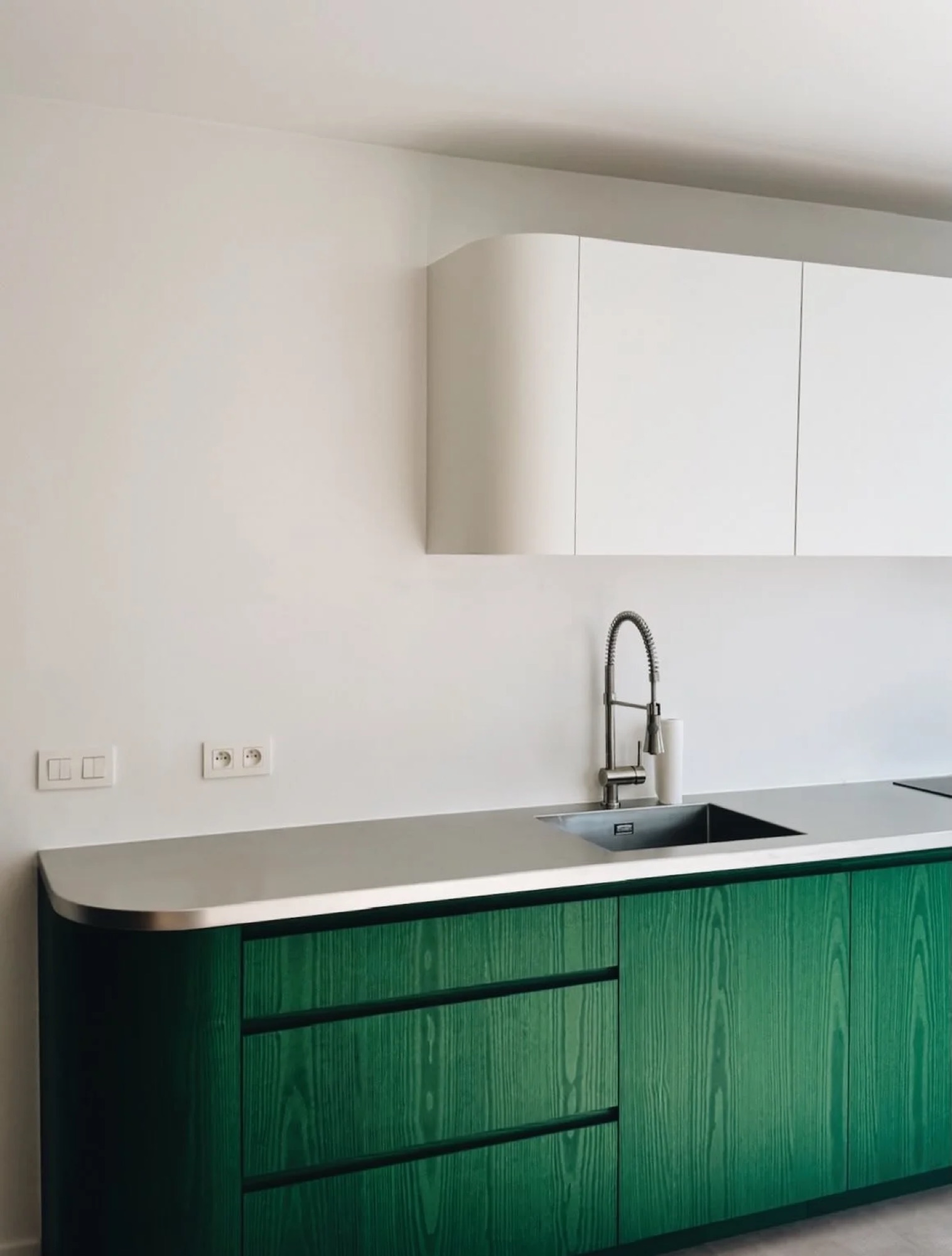 Green kitchen, touches of green across projects